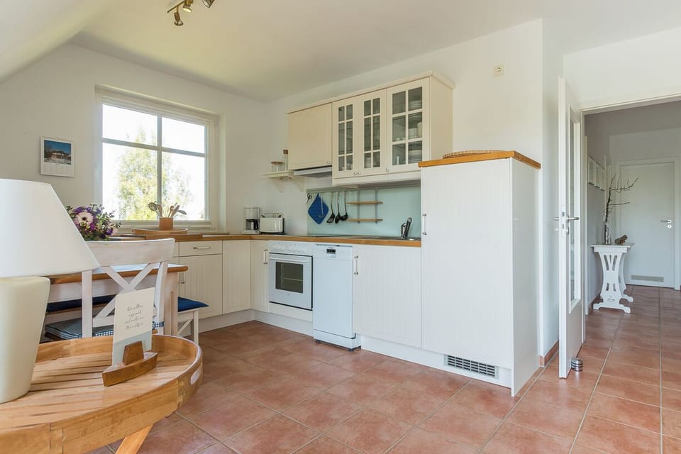 Bright Kitchen with Stove and Dining Table
