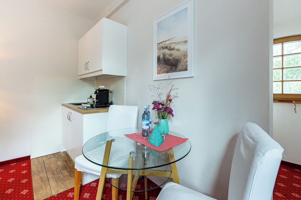 Kitchen with Glass Table and Modern Appliances