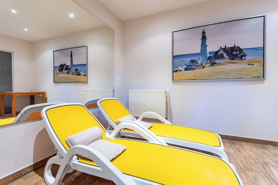 Wellness Area with Yellow Loungers and Nautical Artwork
