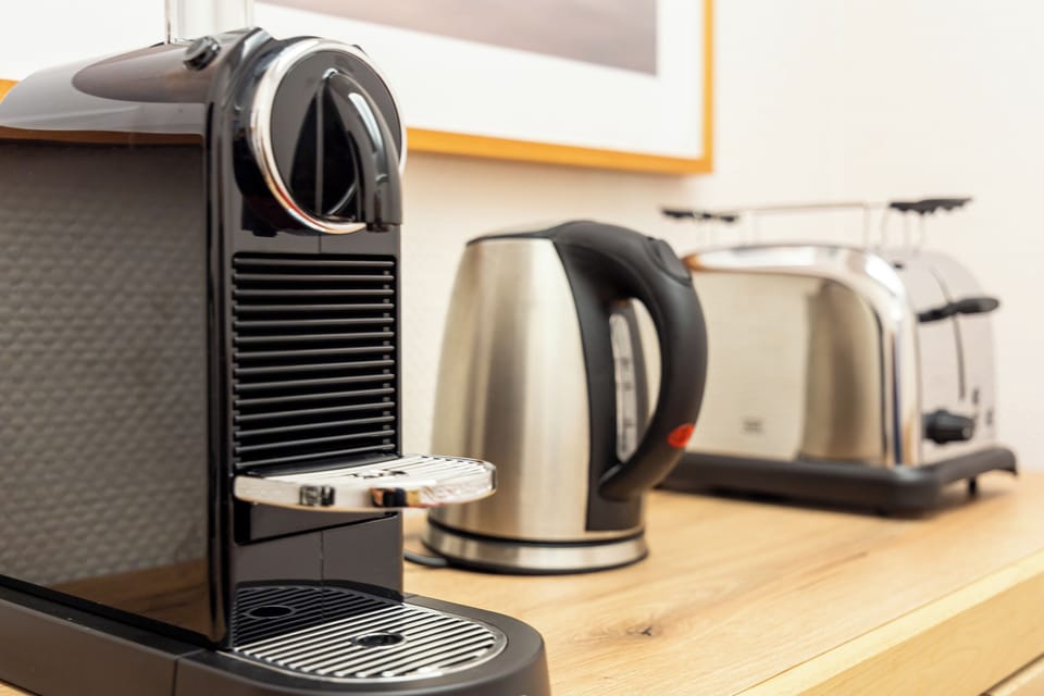 Kitchen with Coffee Machine, Kettle, and Toaster