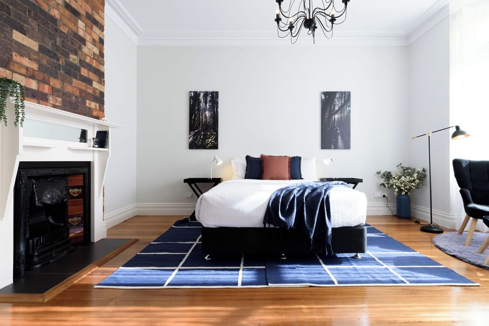 Beautifully restored room with moody blue accents