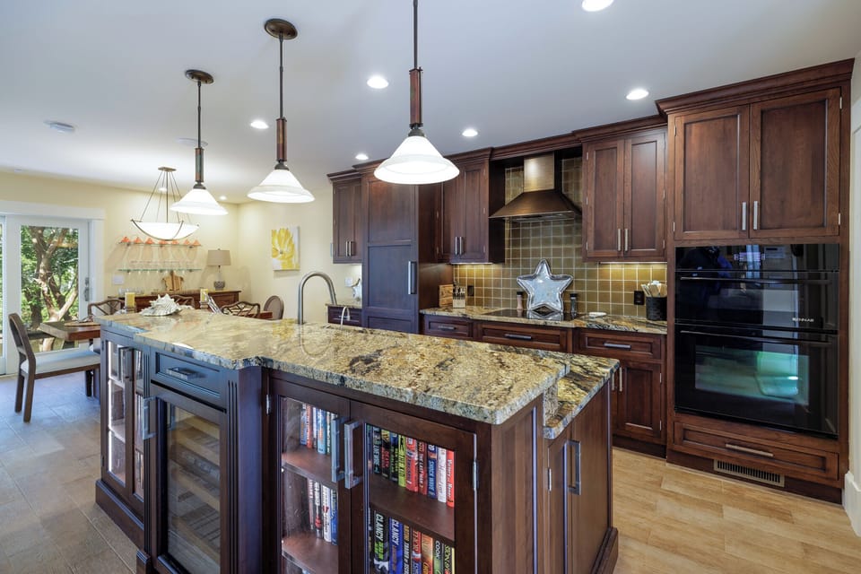 The oversized island anchors the room—ideal for casual meals, entertaining, or gathering after a day out.