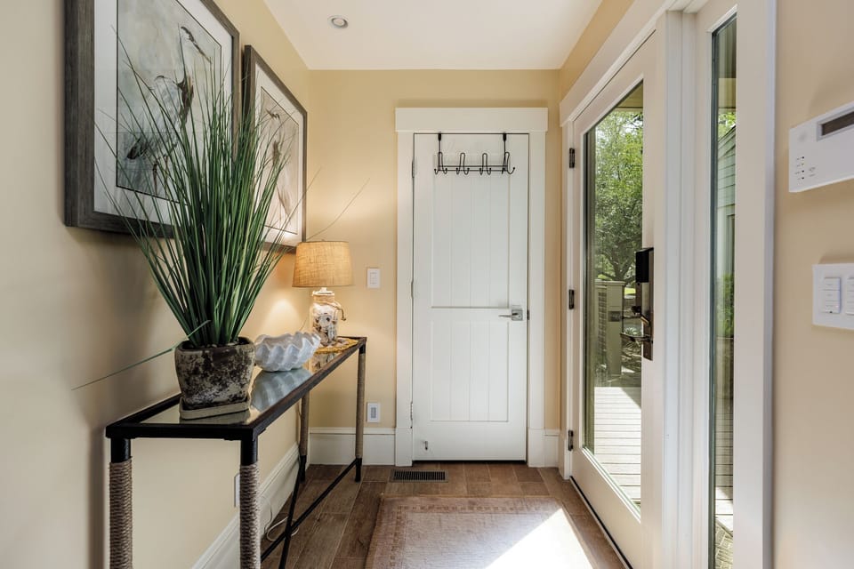 A welcoming entry opens into a bright, open-concept living space designed for both comfort and connection.