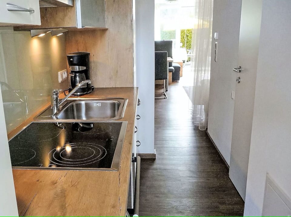 Flooring, Countertop, Wood, Floor, Kitchen, Major Appliance, Interior Design, Kitchen Appliance, Furniture, Sink