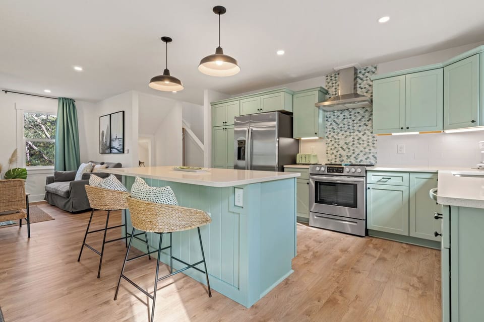 Spacious Modern Kitchen with Bar Seating on Second Level