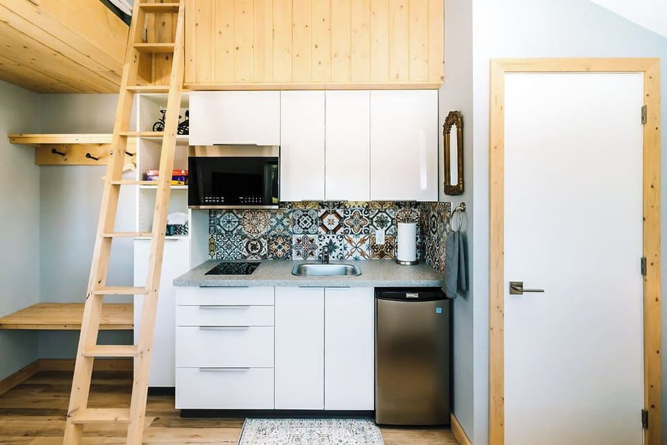 Ladder to loft, kitchen, door to toilet