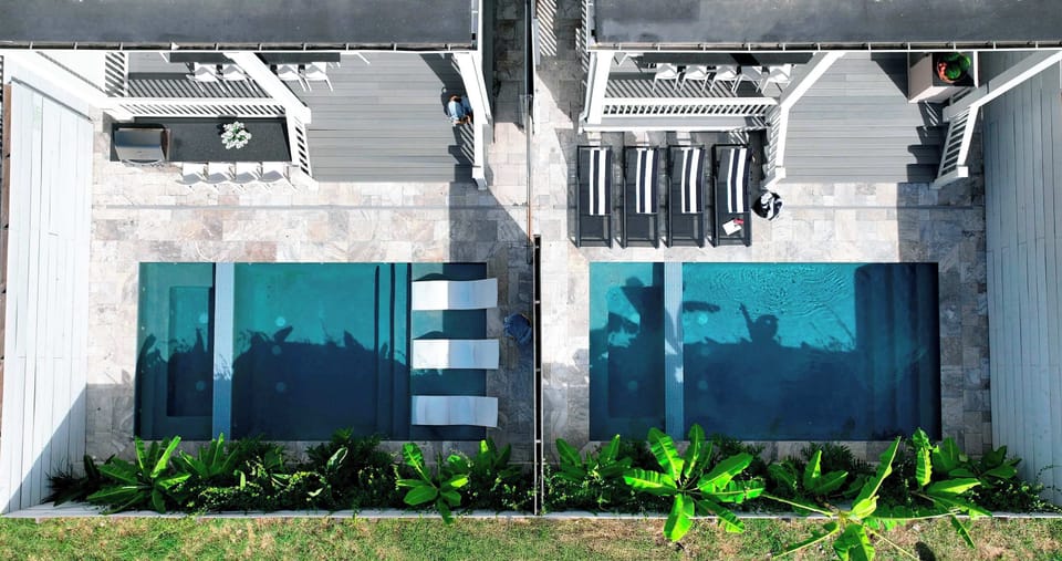 2 side by side single family homes that can connect through a gate in the backyard 