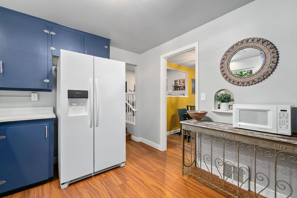 Fully-Equipped Kitchen | Steps to Upper Living Area