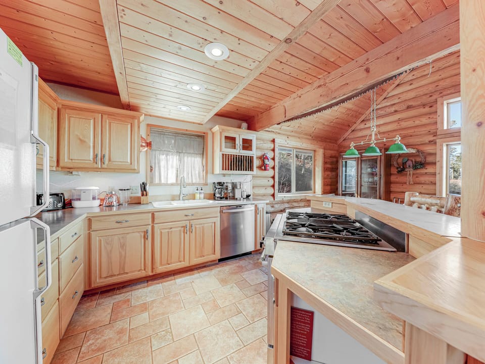 View of the spacious and fully stocked kitchen