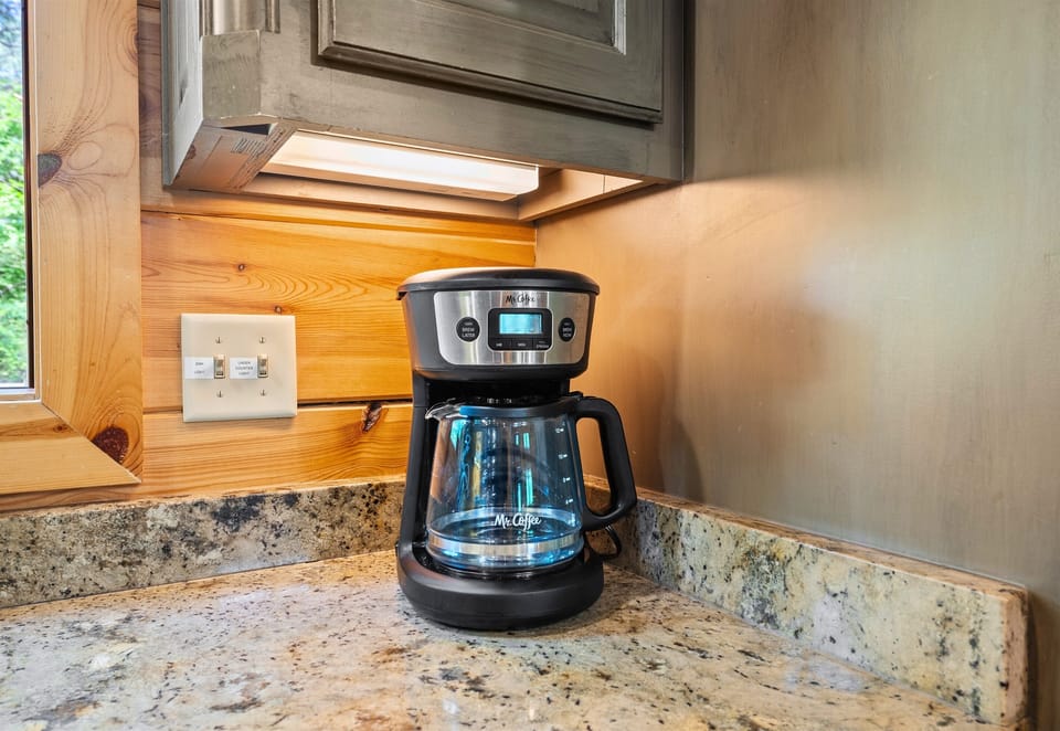Your morning cup of coffee is always within reach—just fire up the drip machine and sip while you watch the sunrise through the trees.