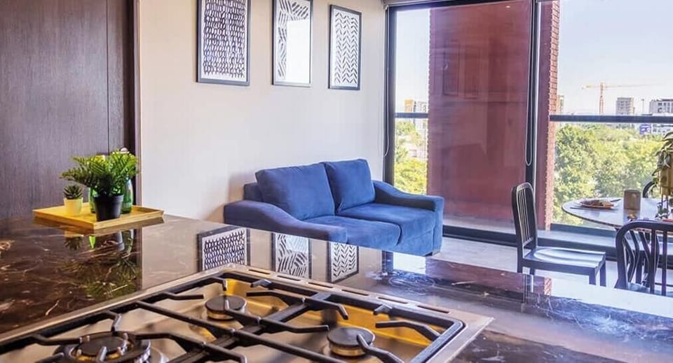 Inviting living room seating area w/ sofa, coffee table & soft natural light