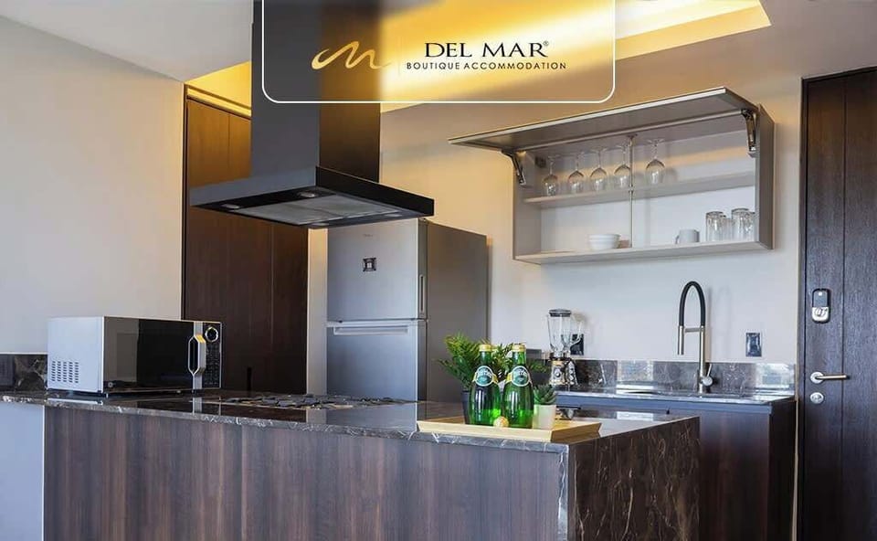 Contemporary kitchen w/ cooktop, range hood & open shelving for easy cooking