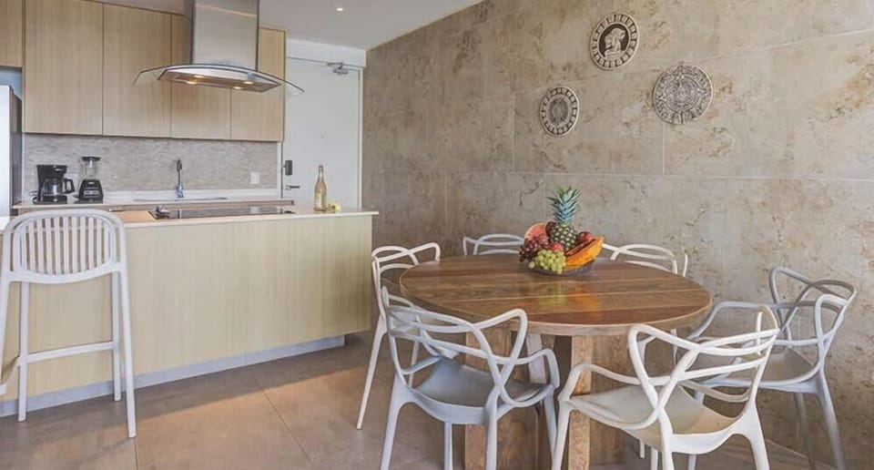 Casual dining nook w/ round table beside the kitchen for easy meals together
