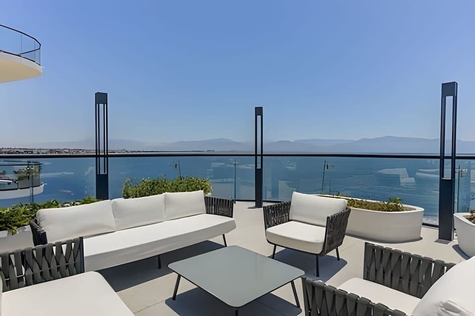 Rooftop terrace w/ lounge seating & sweeping ocean views for sunset drinks or morning coffee