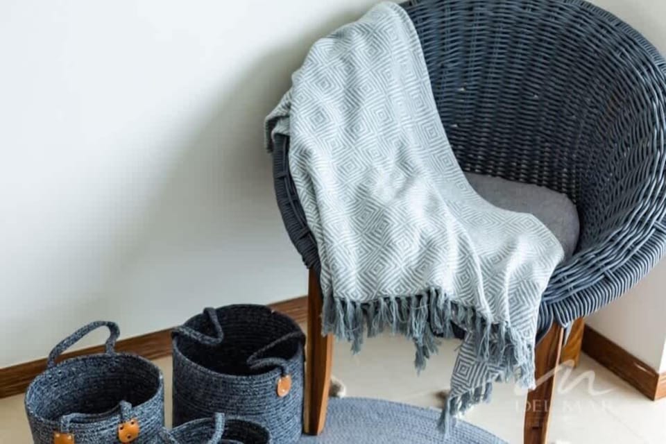 Cozy corner chair w/ textured throw, a quiet nook to unwind w/ a book