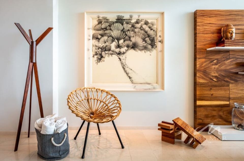 Chic living space entry w/ wood wall feature, chair seating & curated decor