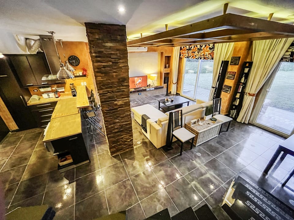 Relax in this tastefully furnished open living area, with a 55-inch TV.