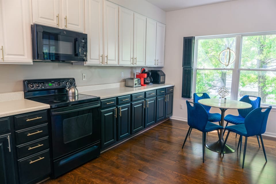 Enjoy coffee and conversation in this bright, fully equipped kitchen - perfect for fall family meals.
