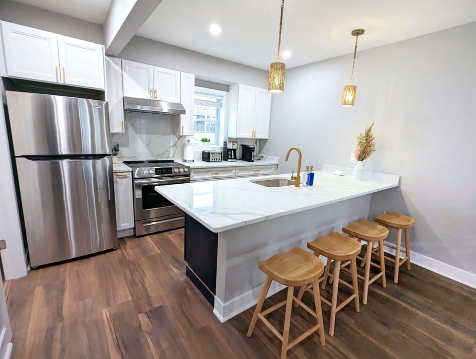 Whip up a masterpiece in our sleek kitchen, complete with all essentials!