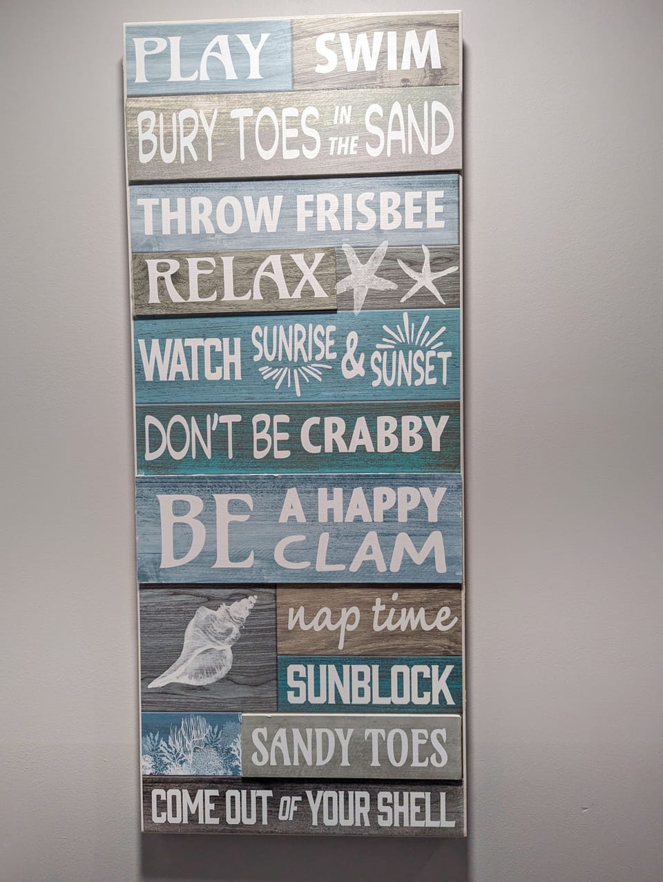 Let this coastal-inspired sign remind you to relax and soak up the sun!
