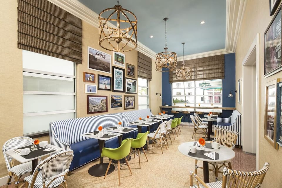 Gather for leisurely meals beneath stylish lighting and art.
