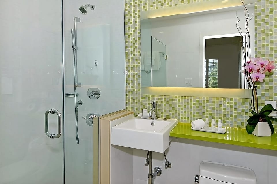 Refresh in a sleek glass shower with spa-bright lighting.