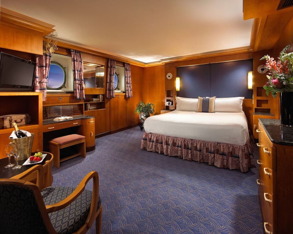 Unwind in a spacious stateroom-style bedroom with luxe comfort.