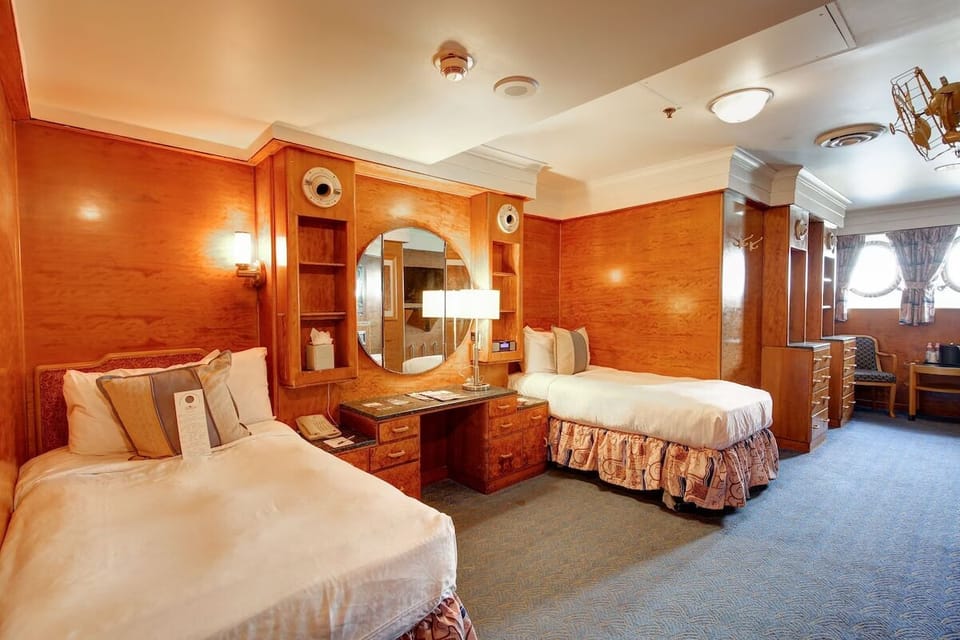 Settle in with twin beds and a bright vanity area.