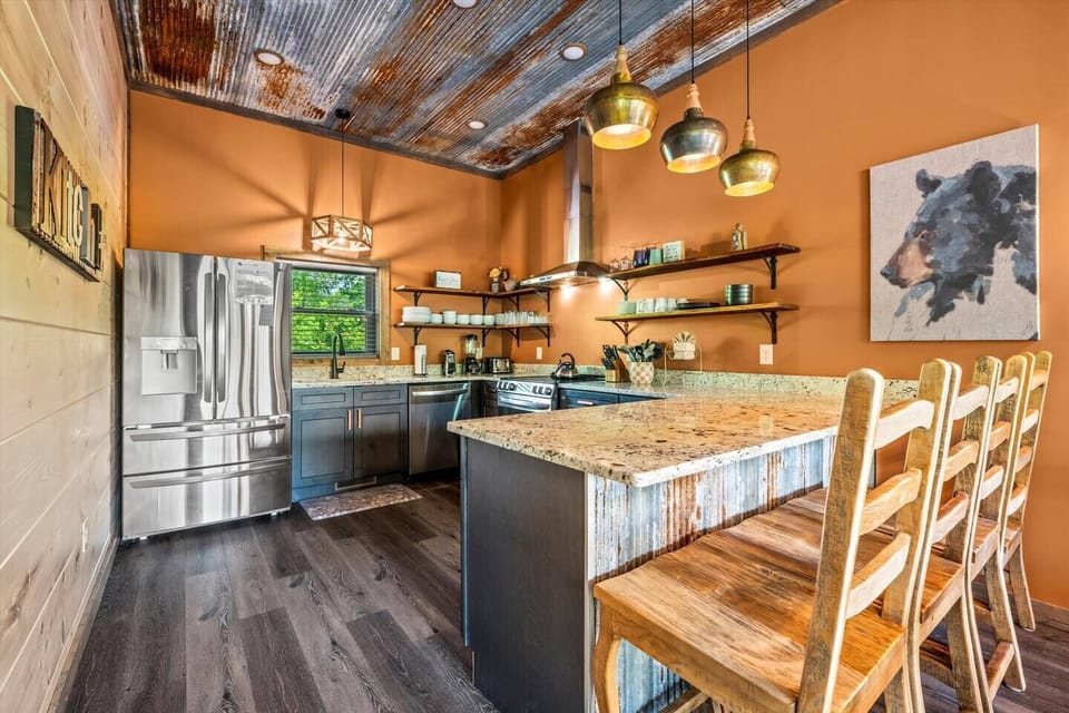 Fully-stocked kitchen with bar seating
