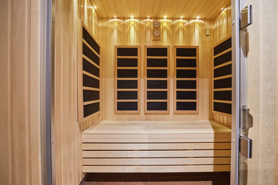 Spacious wood-paneled sauna perfect for relaxing and recharging after a day in the city.