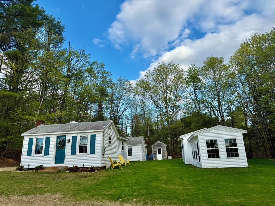 View of yard and three cottages all included in rental sleeps 8 total 