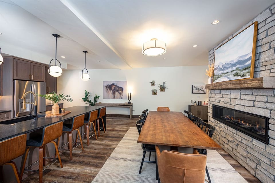 The dining table offers seating for 8, with additional kitchen bar seating for 5 | Main Level