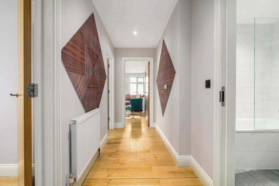 Step inside through a beautifully styled entrance and welcoming hallway, thoughtfully designed with elegant decor to create a warm first impression