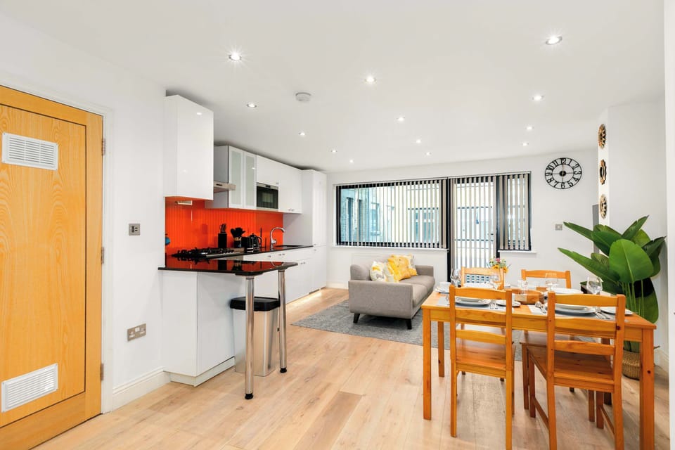 Flooded with natural light, this stylish open-plan living, kitchen and dining area offers a bright, airy space designed for comfort and togetherness
