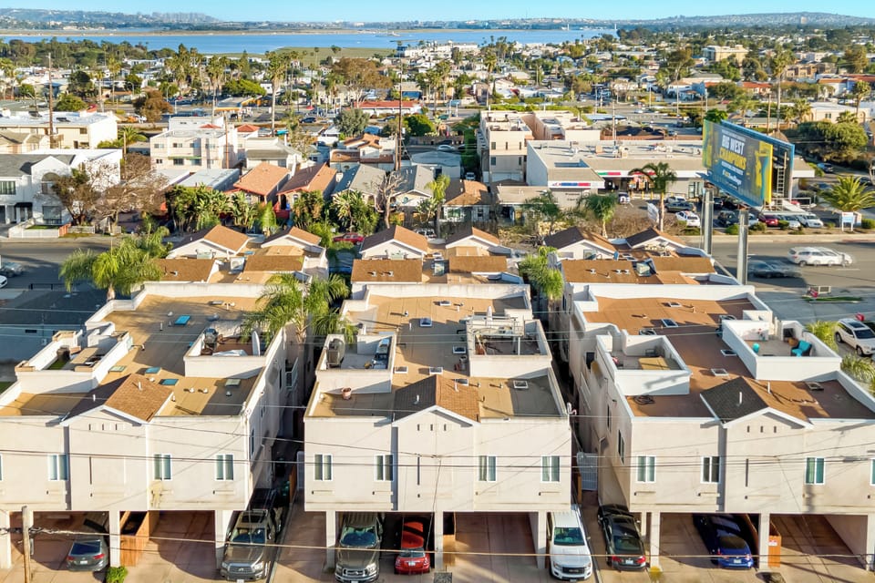 Aerial view of the neighborhood with a stunning water view!