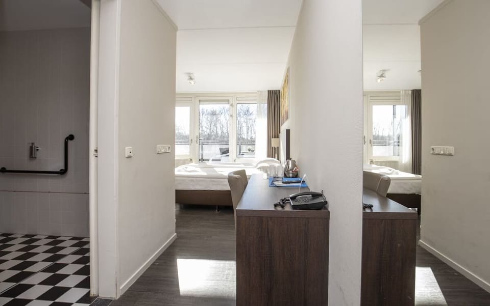 Unit with 4 single beds. Exact unit will be assigned upon arrival. Views, colors, and decor may vary.