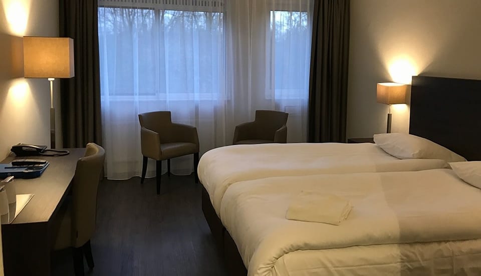 Unit with 2 single beds. Exact unit will be assigned upon arrival. Views, colors, and decor may vary.
