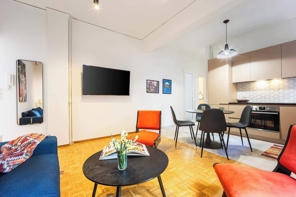 Modern lounge and dining setup with clean design, offering a stylish setting for relaxing meals or conversations.