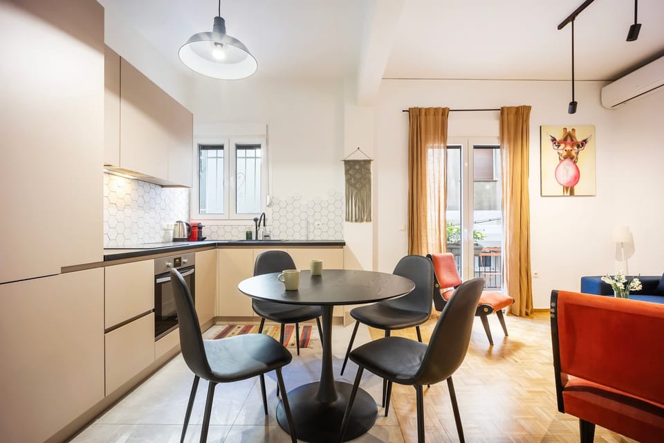 Stylish dining area with warm lighting and balcony views, creating a comfortable space for shared meals or quiet moments