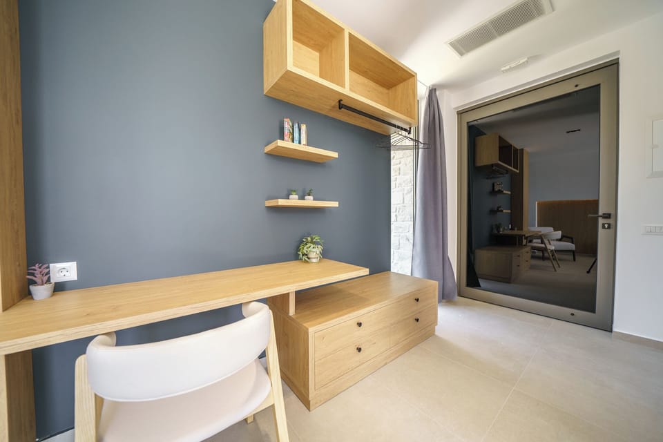 Ground Floor: Bedroom 1 with queen bed and ensuite bathroom