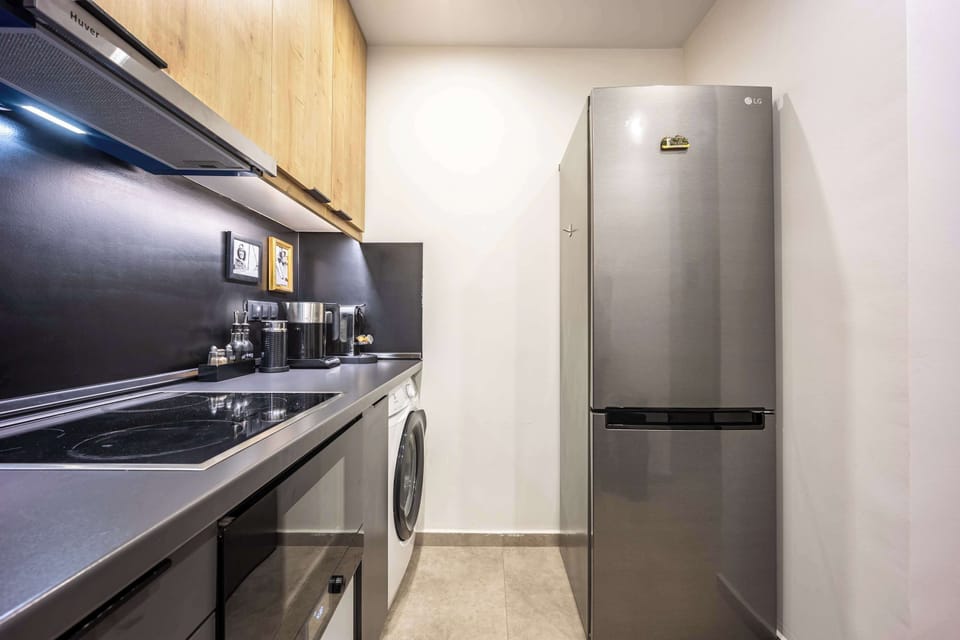 This sleek kitchen offers plenty of storage and a full-size fridge—perfect for longer stays. Guests especially value the well-organized setup.