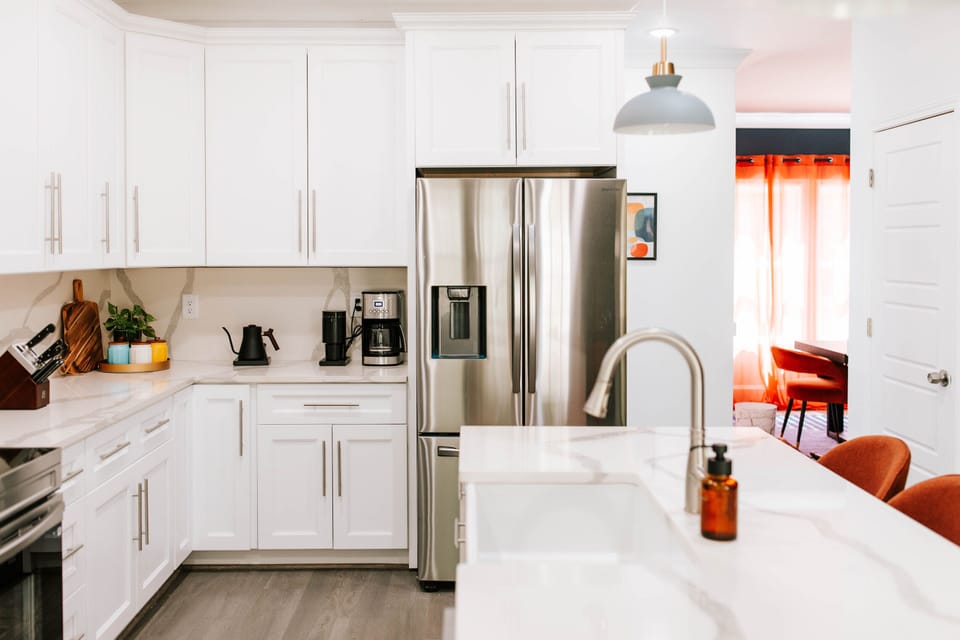This sleek, coffee-lover’s kitchen is fully stocked and ready to fuel your day—from espresso shots to smoothie sips, all in serious style.