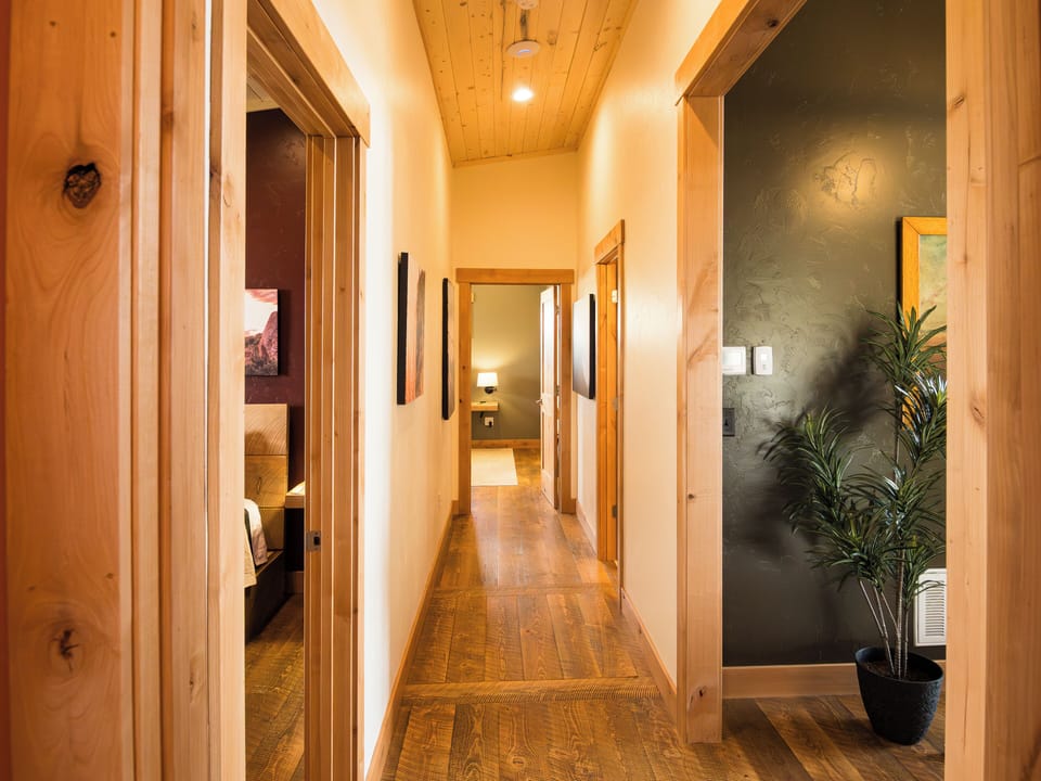 Clean lines and quiet transitions. This central hallway connects bedrooms and bathrooms with ease—simple, intentional, and easy to navigate.