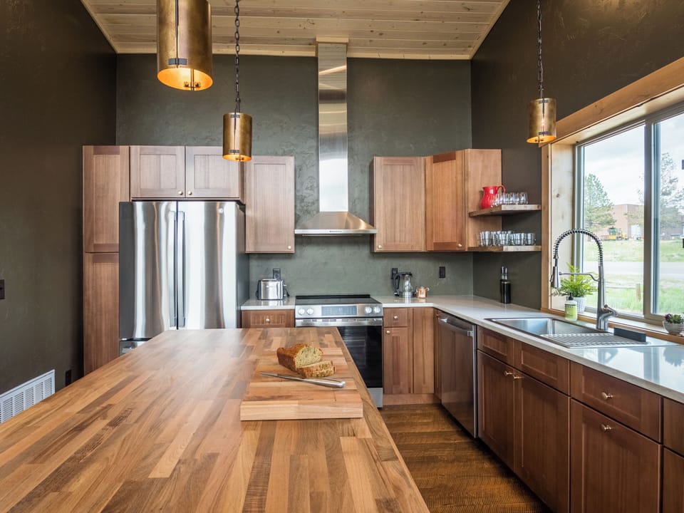 A handcrafted kitchen built for shared meals and easy mornings. With open shelving, quartz countertops, a warm butcher block island and everything within reach, you’ll feel right at home.