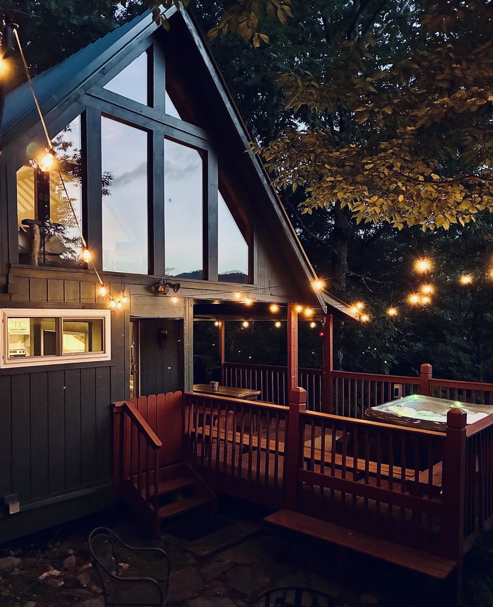 Dreamy string lights over the back deck and firepit area!
