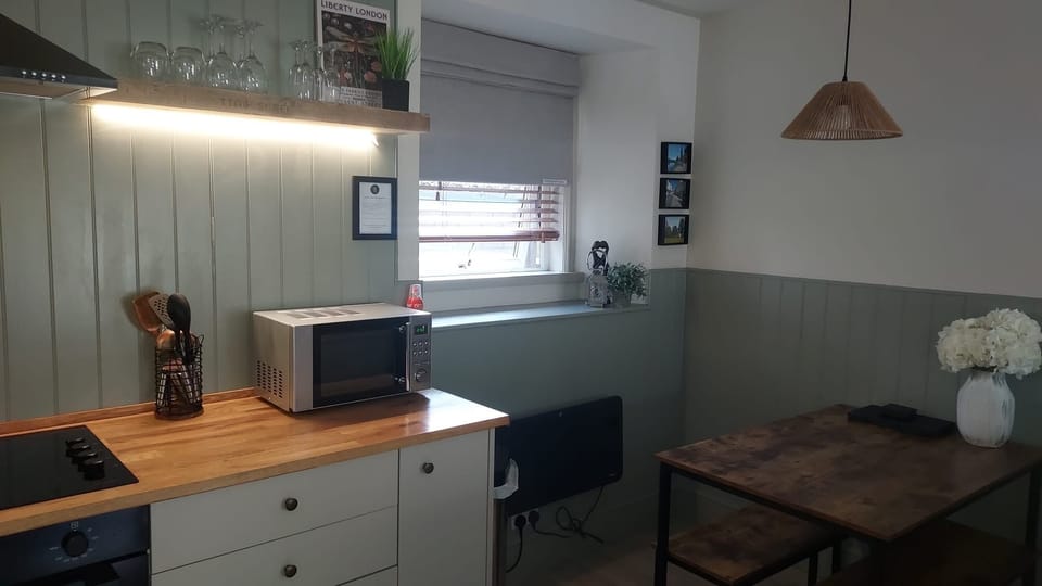 Open layout - kitchen flows into dining area. 