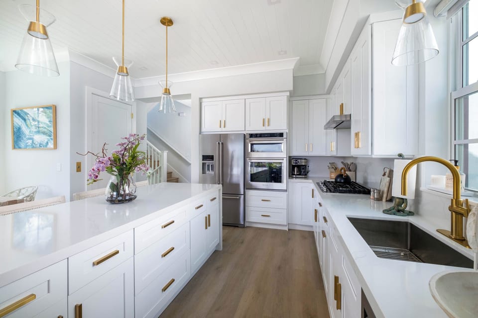 Luxury oceanfront rental with modern chef’s kitchen and island seating