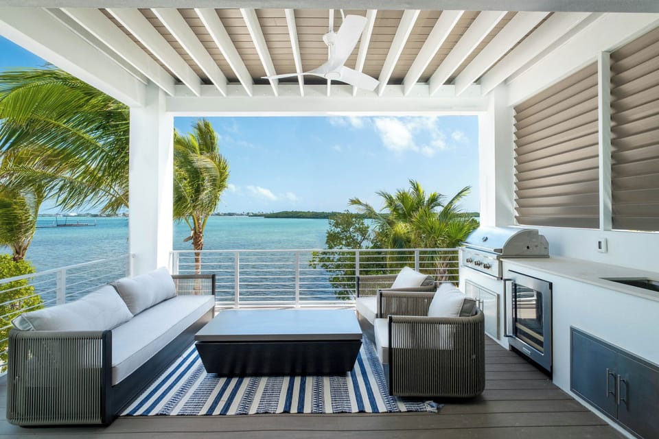 Outdoor oasis with grill and stunning ocean views—perfect for sunset dining