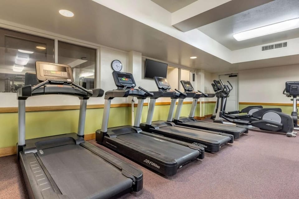 Recharge with a focused workout in the bright fitness room.
