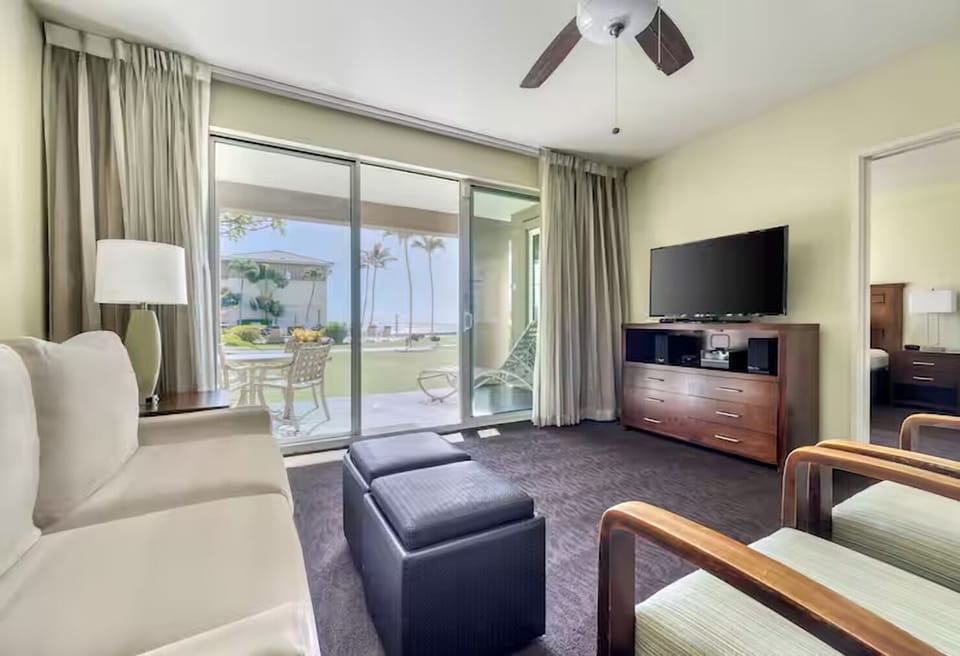 Lounge by the sliders and savor ocean-breeze views outside.